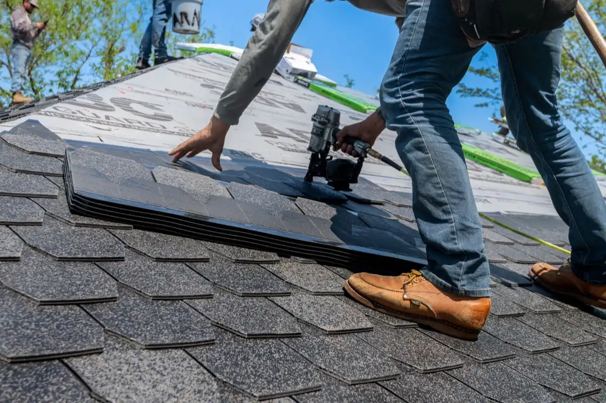 Inspecting an asphalt shingle slope after a hailstorm in Naples, FL